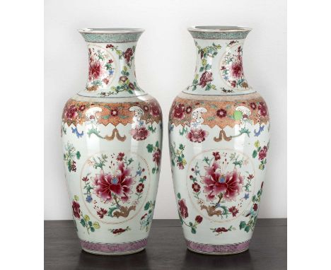 Pair of famille rose porcelain vasesChinese, 18th/19th Centuryeach painted with panels of peonies and other flowers, within g