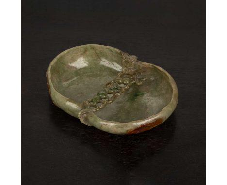 Mottled green jade shallow dishChinese, 19th Centuryshaped as a lotus leaf, with two smaller leaves highlighted by brown spla