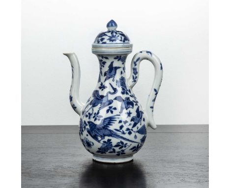 Blue and white porcelain ewer and coverChinese, 18th/19th Centurypainted with phoenix and other birds amongst leaf sprays, wi