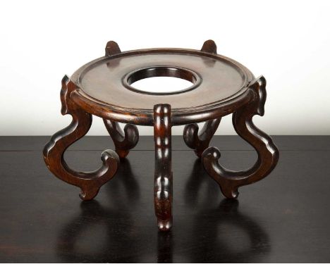 Hardwood jardiniere standChineseof circular form and with scroll supports, 35cm diameter x 26cm highThe joints are firm, but 