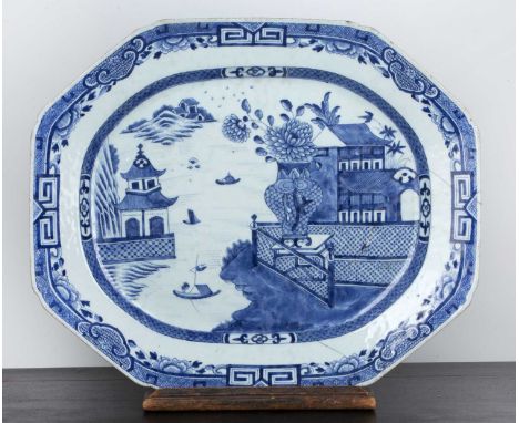 Large export blue and white porcelain meat plateChinese, early 19th Centurywith a river landscape scene and large vase of peo