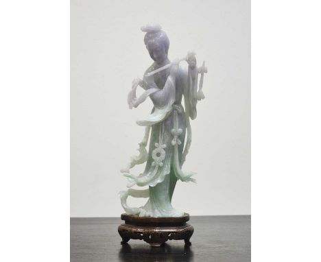 Mottled white and green-tinted jade figureChinese, Republican periodfinely carved and detailed as a standing figure of Yang K