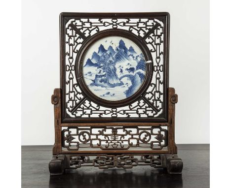 Circular blue and white porcelain and hardwood table screenChinese, 19th Centurythe panel is painted with an ox and herdsman 