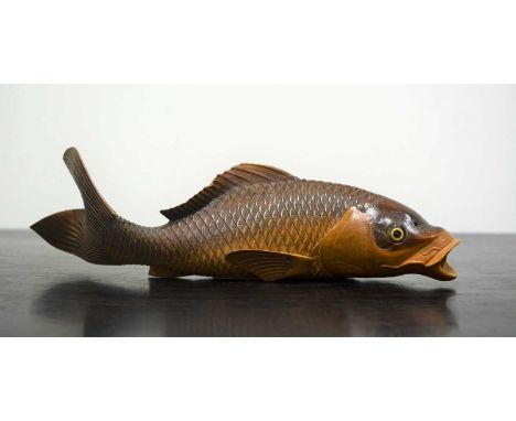 Wood carving of a swimming koiJapanese, mid Meijifinely carved two-tone brown wood, with open mouth breathing holes and inlai