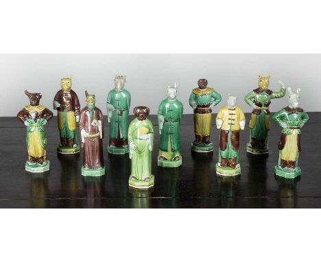 Ten glazed porcelain Zodiac figuresChinese, 19th Centuryall dressed in formal clothes, set in human bodies, 17.5cm high (10)O