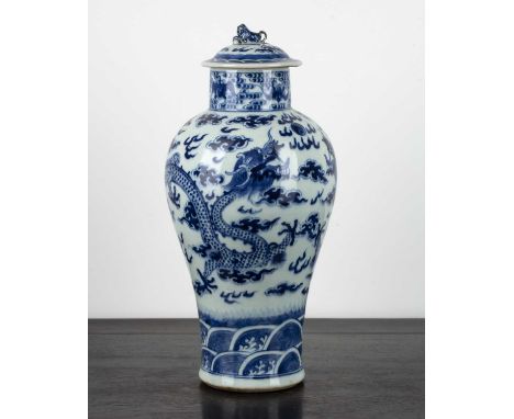 Blue and white porcelain vase and coverChinese, 19th Centurypainted with dragons and flaming pearls, and with kylin finial, 3