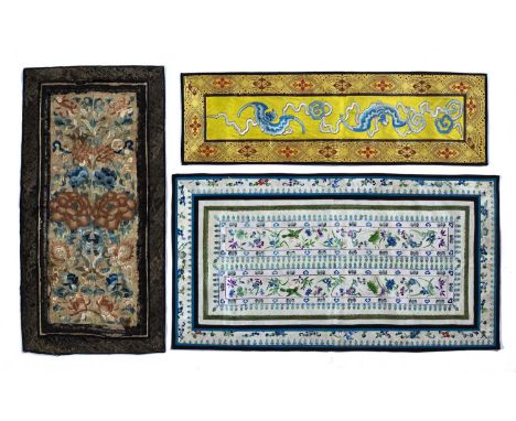 Three embroidered panelsChinese, 19th & 20th Centurythe first decorated with peonies and other flowers in a central panel sur