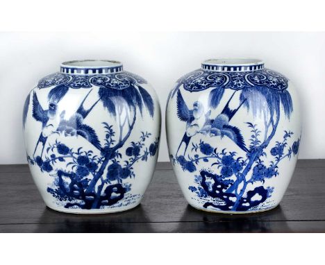 Pair of blue and white porcelain jarsChinese, 19th Centuryeach painted with rockwork, swifts and pine trees, within ruyi bord
