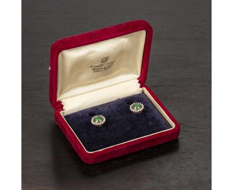 Pair of cluster earringsChinesethe jade cabochon centres surrounded by pearls, the screw back mounts stamped '14K', 1.2cm acr