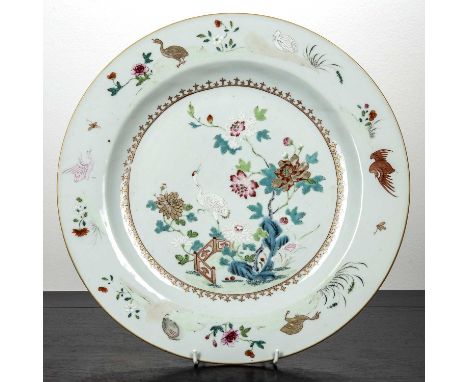Famille verte porcelain chargerChinese, 18th Centurypainted with phoenix, storks, and other birds, and with peonies and fence