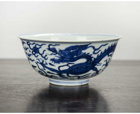 Blue and white porcelain bowlChinesepainted with a dragon and flaming pearls, with Chenghua mark, 13cm x 5.5cmSmall chip to t