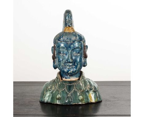 Glazed porcelain model of Guanyin's headChinesedecorated in turquoise and yellow enamels, resting on a separate porcelain bas