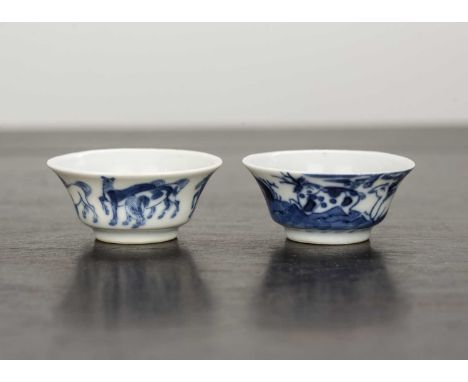 Two miniature blue and white porcelain teabowlsChinese,painted with horses, figures, deer, and inscriptions and with Chenghua