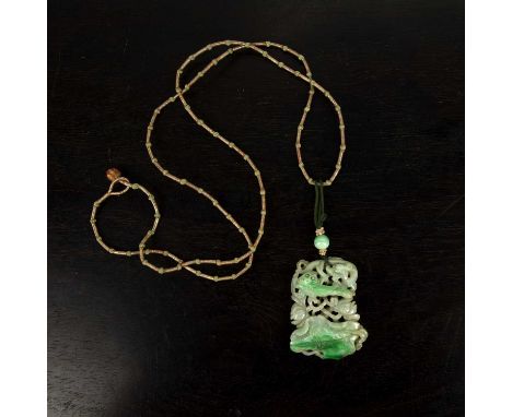 Carved jade pendantChinesecarved depicting a fish swimming above a lotus leaf, 5cm acrossUntested for origin/treatments. Natu