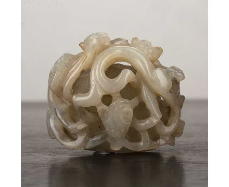Mutton jade hat finialChinese, Yuan periodcarved and pierced with four piercings for mounting and carved as three entwined Ch