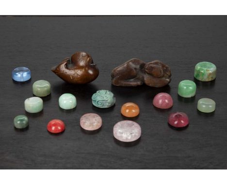 Group of snuff bottle stoppersChineseincluding jade, glass and hardstone, a hardstone model ram, 5.5cm and a wood netsuke duc