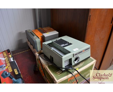 A Prince projector together with a box of various slides etc.