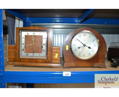 A two hole mantel clock together with a three hole mantel clock