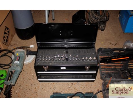 A metal tool box with part contents