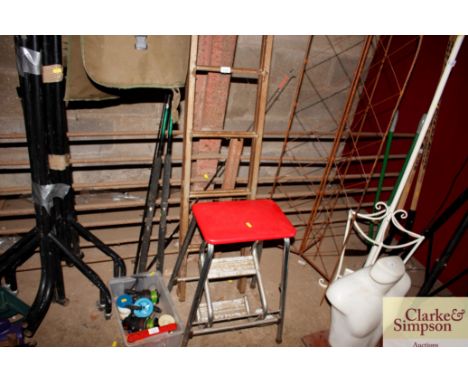 A folding metal ladder and a step stool