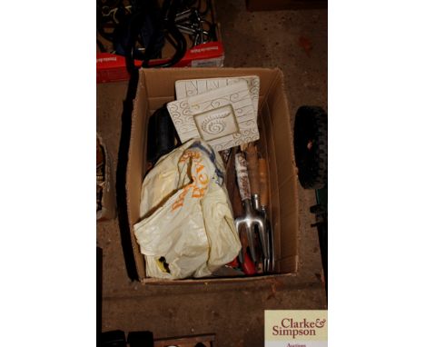 A box of various hand tools and a pair of straps