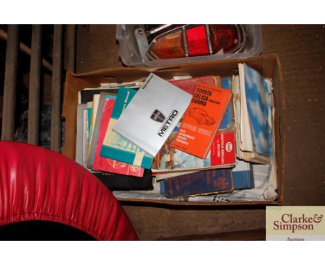 A box of vintage motoring books etc