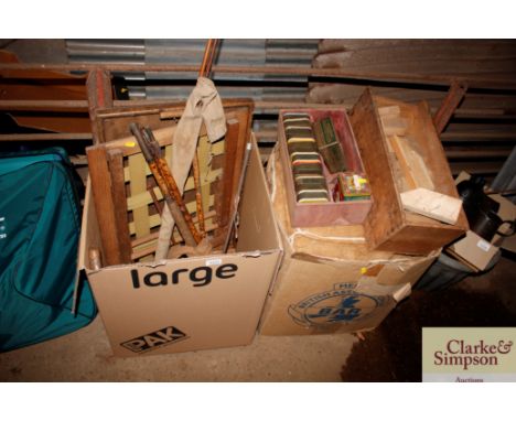 Two boxes containing vintage fishing rods; riding crop; wooden tray; various tins; sacks etc