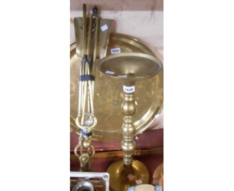 A quantity of brass fire irons, toasting fork and a plant stand