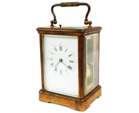 An antique brass and bevelled glass cased carriage clock with Aiguilles (Paris) eight day strike/repeat gong striking movemen