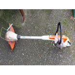 A Stihl electric garden strimmer and charger