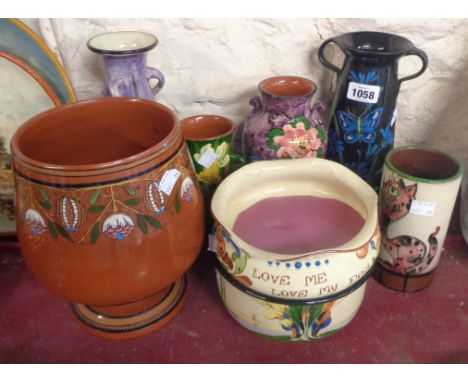 A quantity of Torquay pottery including vases and bowls, various patterns including butterfly, daffodil, etc. - various maker