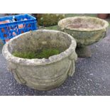 A concrete urn style planter set on pedestal base - sold with another planter