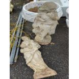 Two female form garden statues