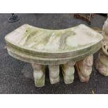 Two decorative curved concrete benches