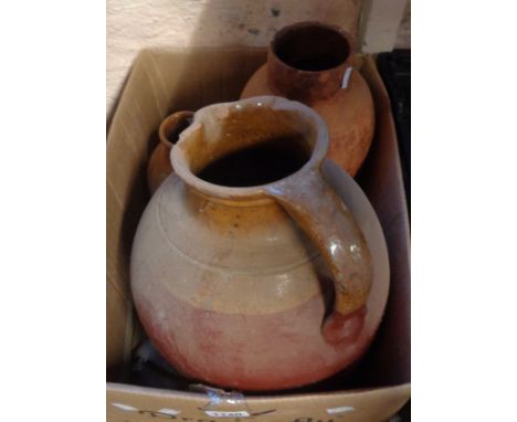 A large Verwood style country pottery milk jug with brown glazed shoulder and painted finish - sold with a similar jar and an