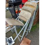 A metal folding chair with distressed finish - sold with four beech and metal folding chairs