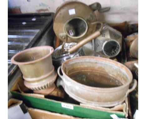 A box containing an oil lamp and painted metal candlesticks, etc.