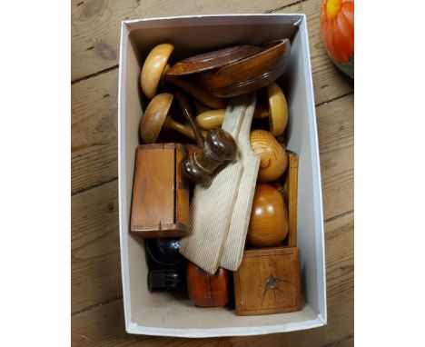 A box containing a quantity of treen items including butter pats, small trinket boxes, wooden gavel, etc.