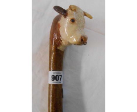 A novelty walking stick with Hereford bull's head pattern handle