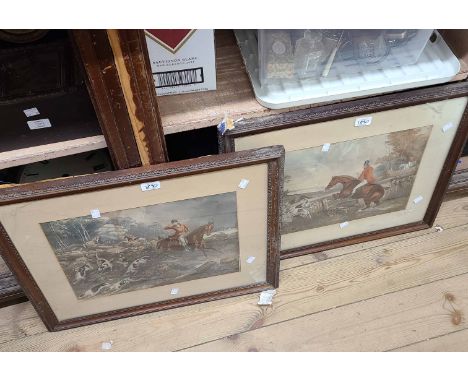 A pair of antique oak framed coloured hunting prints