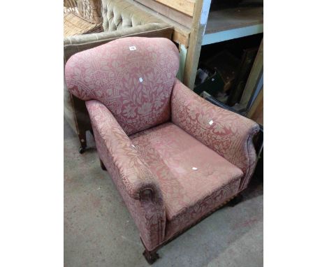 A 20th Century parlour armchair with machine tapestry floral pattern upholstery, set on mahogany claw and ball feet