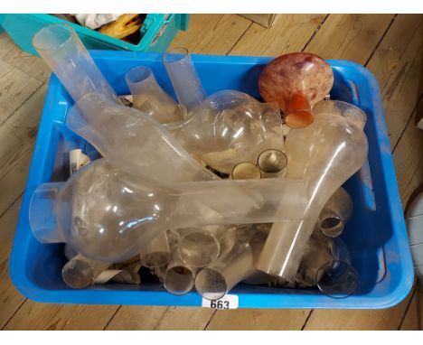 A blue crate containing a quantity of oil lamp chimneys
