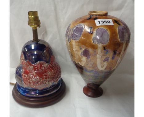 A Lise B. Moorcroft pottery table lamp with tube-lined decoration, depicting grotesque fish with red luster decoration on a b