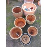 A quantity of terracotta garden pots
