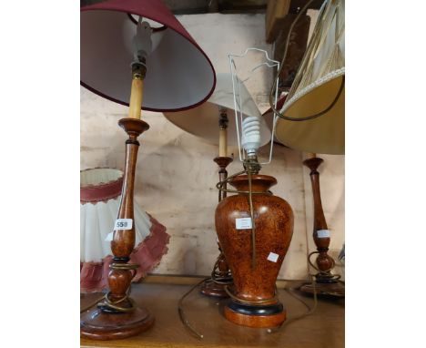 Three wooden candlestick style table lamps - sold with a ceramic baluster form lamp base, all with brown scumble effect finis