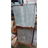 Two galvanised metal feed stores