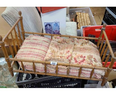 An old simulated bamboo framed doll's cot