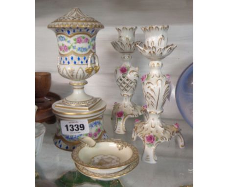 A Dresden porcelain lidded urn on pedestal base (a/f) - sold with a pair of German porcelain flower encrusted candlesticks an