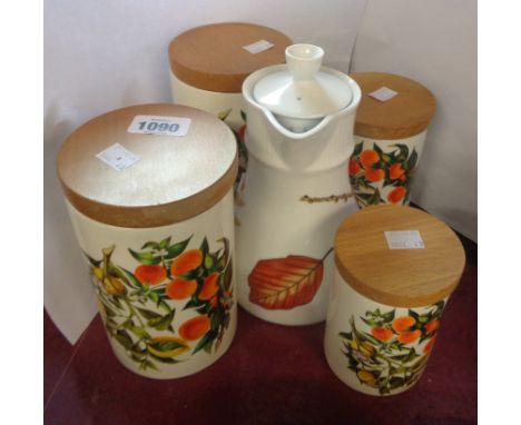 A set of four Portmeirion pottery graduated storage jars in the 'Oranges and Lemons' pattern, with original wooden lids - sol