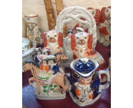 A quantity of Staffordshire figurines comprising a pair of flatbacks 'Going to Market' and 'Returning Home', a pair of comfor